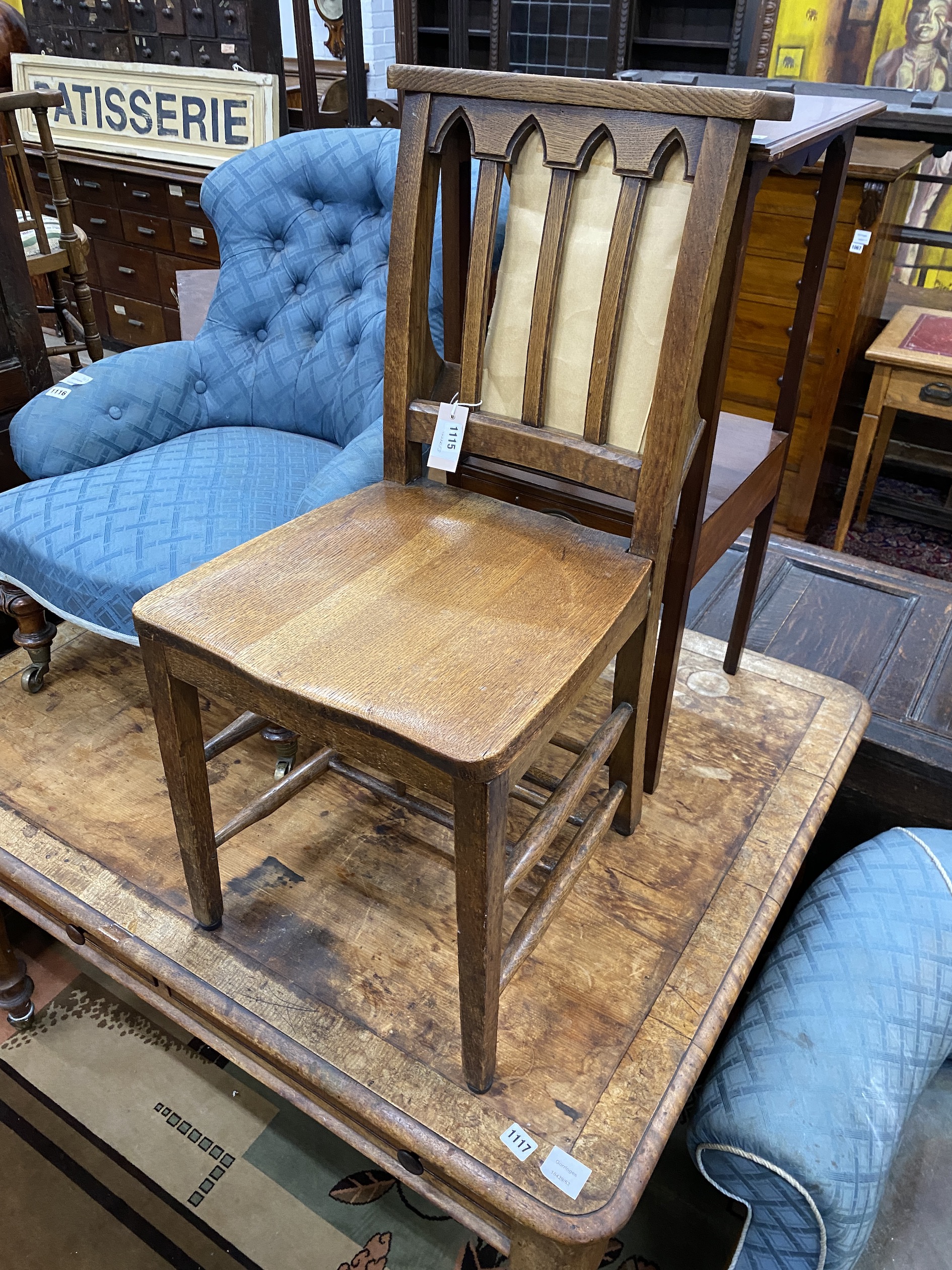 A Westminster Abbey oak chapel chair in the Gothic style, used in numerous historic occasions 1953-1997, with certificate of authenticity, dated 20th March, 1998, one of 272, stamp for Glenister Maker Wycombe, MK., width
